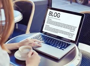 Website blogging with laptop